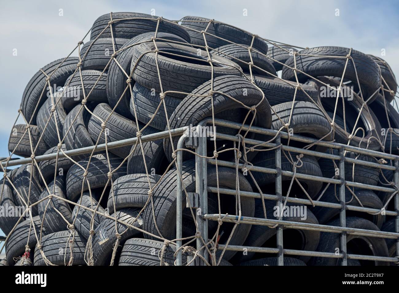 Used car tires being transported in a pickup truck. Stock Photo