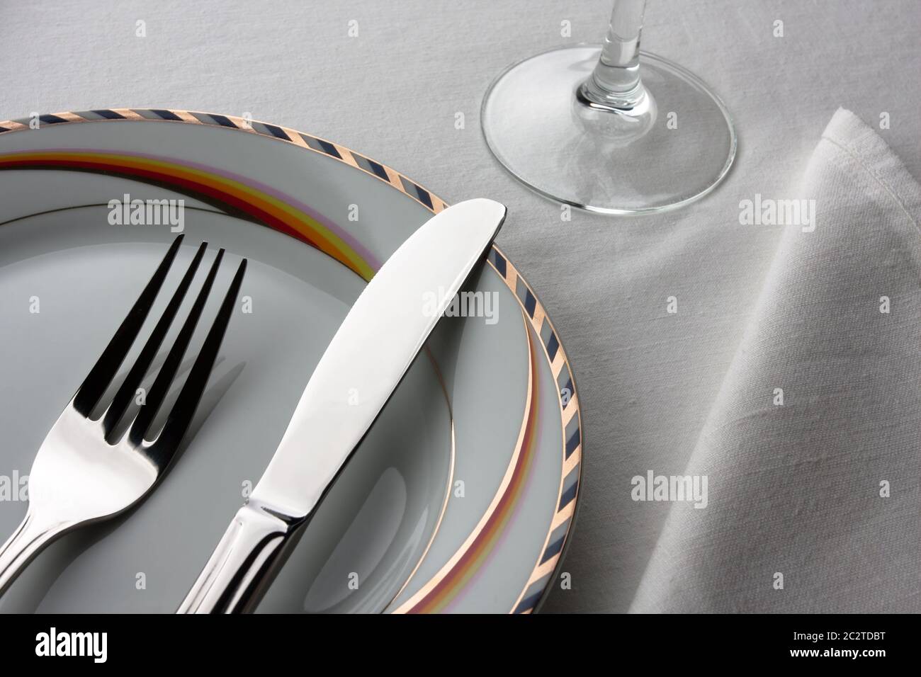 Dinner set. Fork and knife on plate Stock Photo - Alamy