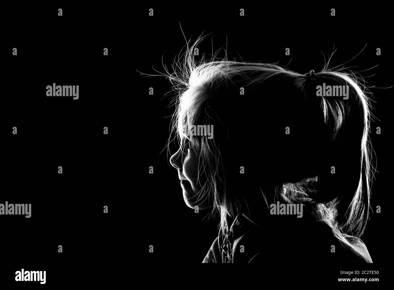 Little Girl Looking In The Darkness With A Little Ray Of Light Stock Photo Alamy
