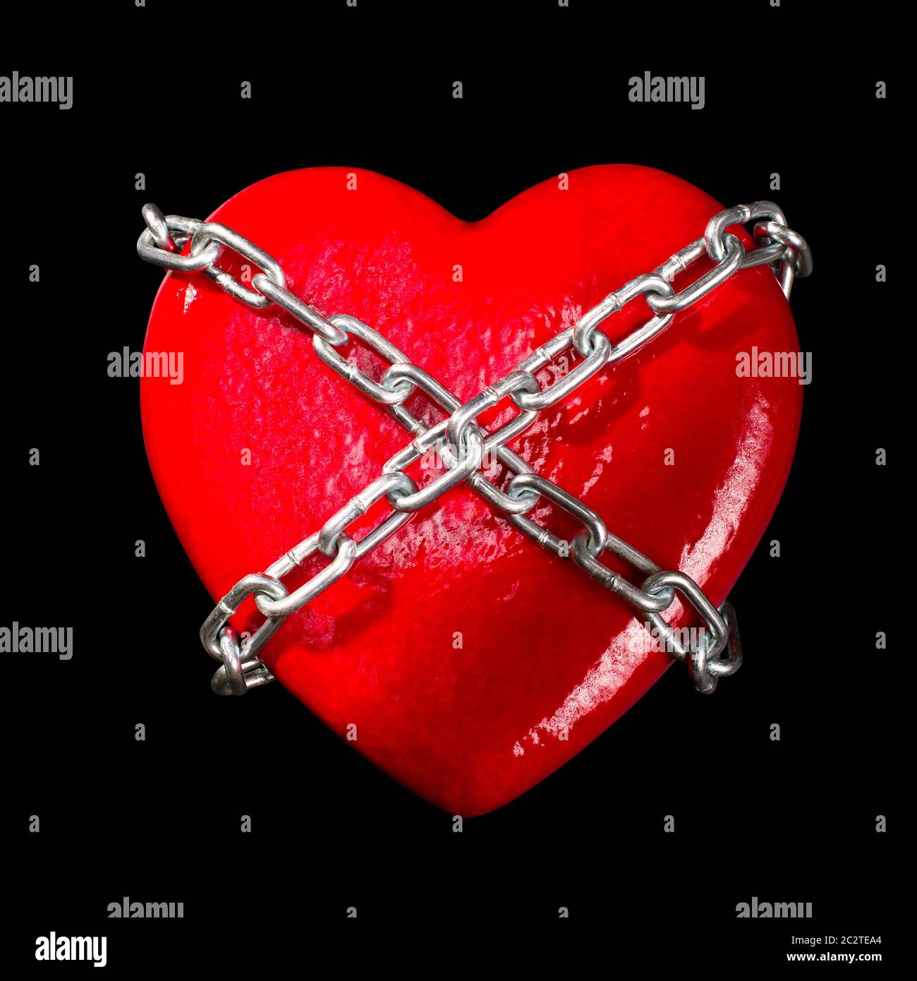 Chained red heart. Isolated on black Stock Photo - Alamy