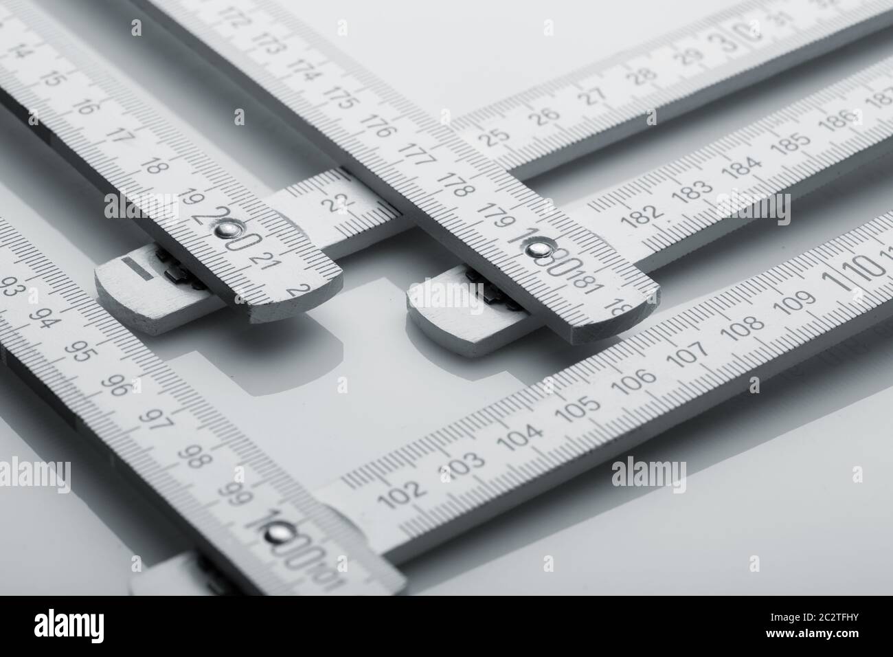 Metal metre measure ruler over white Stock Photo Alamy