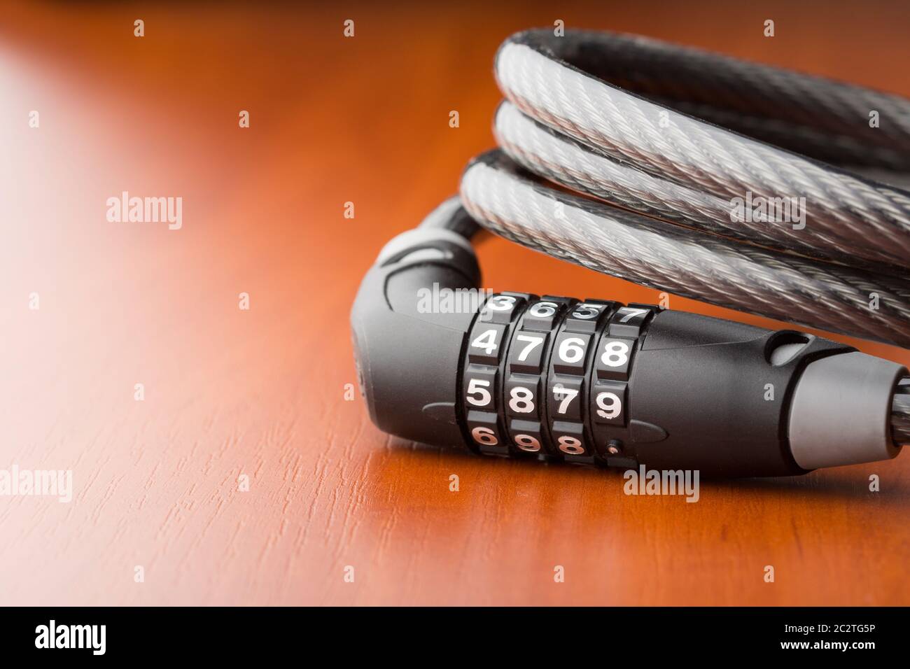 Lock for bycicle on the table Stock Photo
