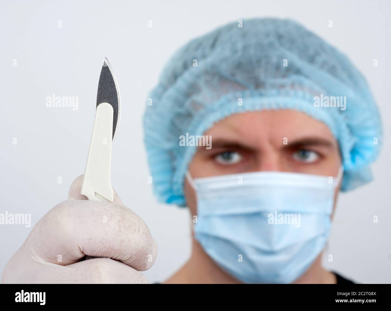Portrait of serious surgeon with surgical knife Stock Photo Alamy
