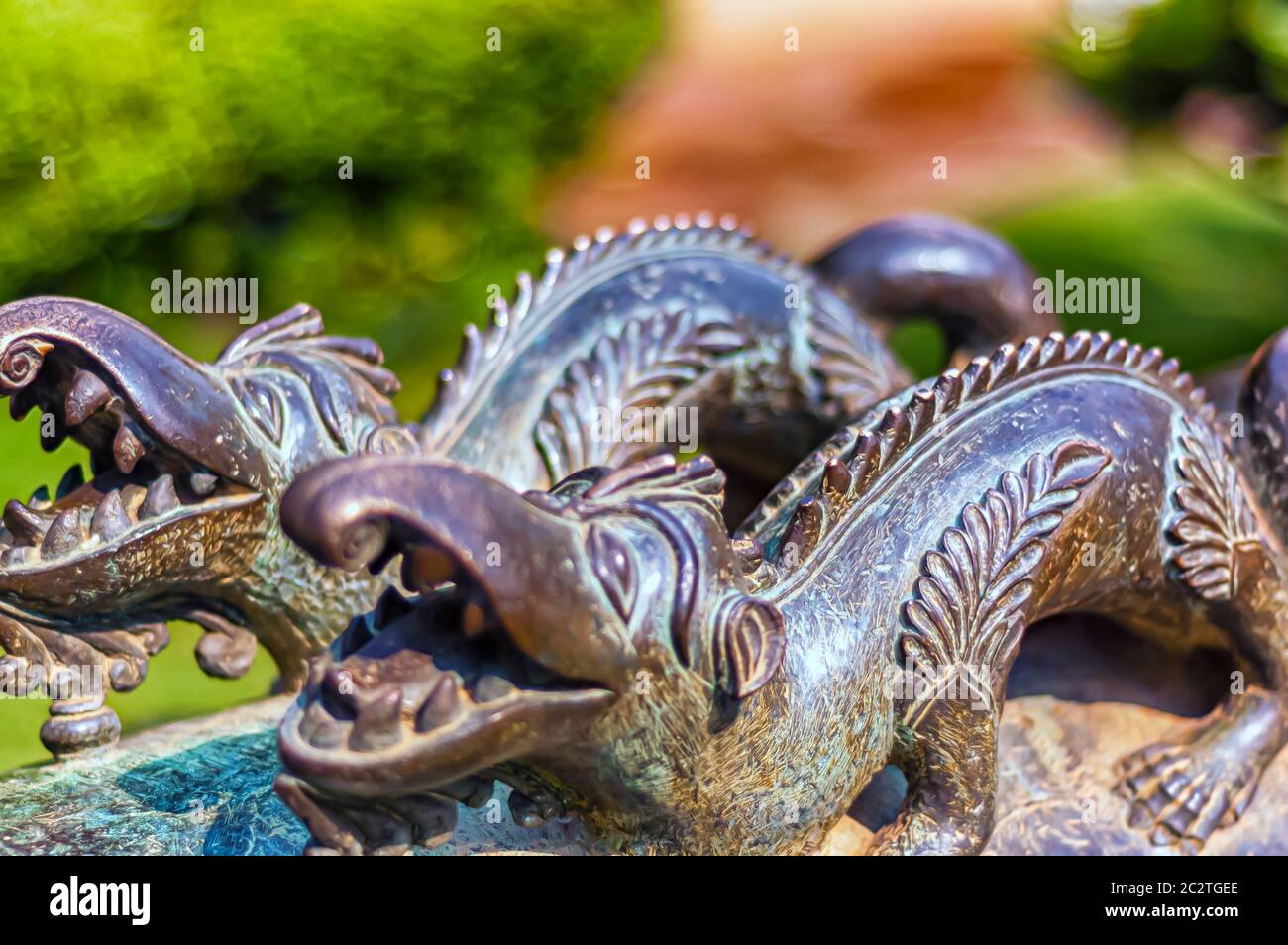 A pair of iron dragons forged atop the barrel of a cannon at Chowmahalla palace in Hyderabad, Telangana, India. Stock Photo