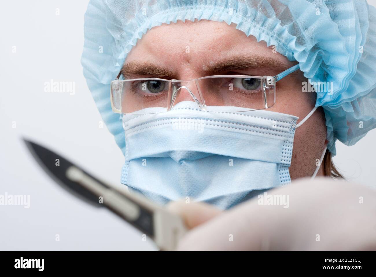 Portrait of serious surgeon with surgical knife Stock Photo Alamy