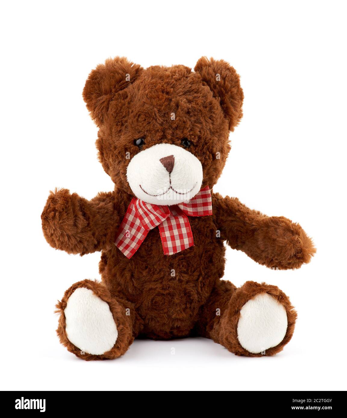 little cute brown teddy bear with a red bow on his neck isolated on a ...