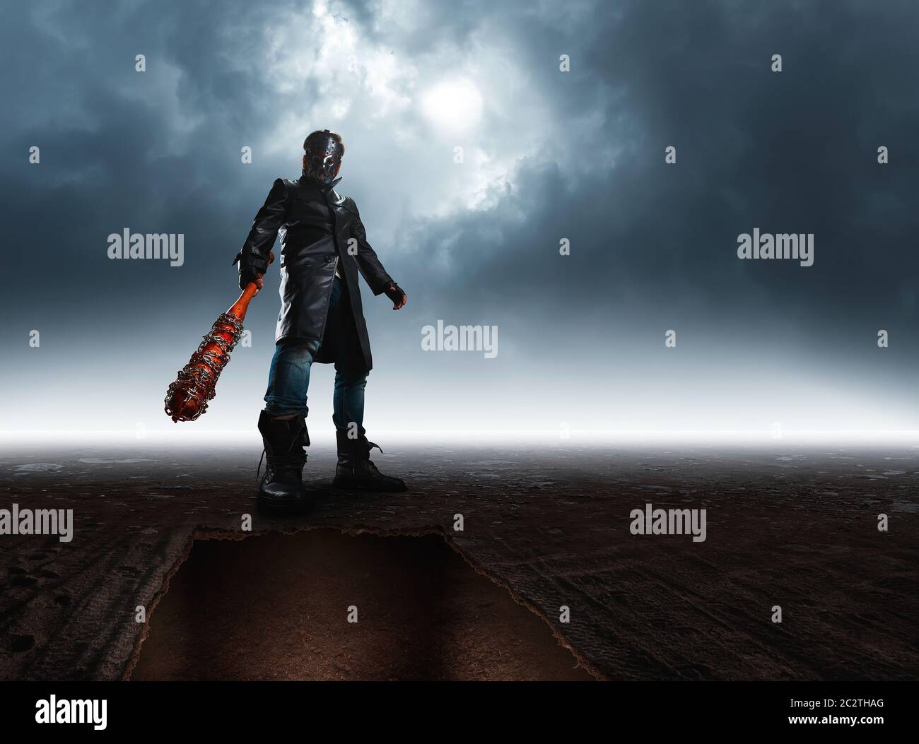 Bottom view of serial killer in hockey mask and black leather coat with