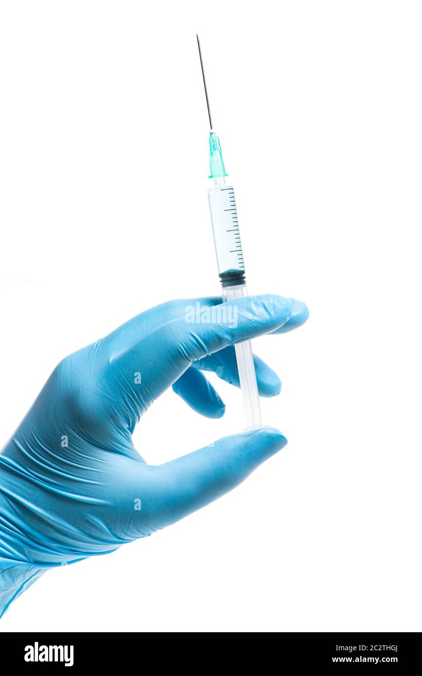 Hand with blue glove holding a syringe white background Stock Photo - Alamy