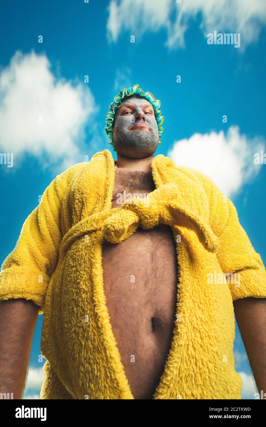 Strange, odd man with face pack against the sky Stock Photo