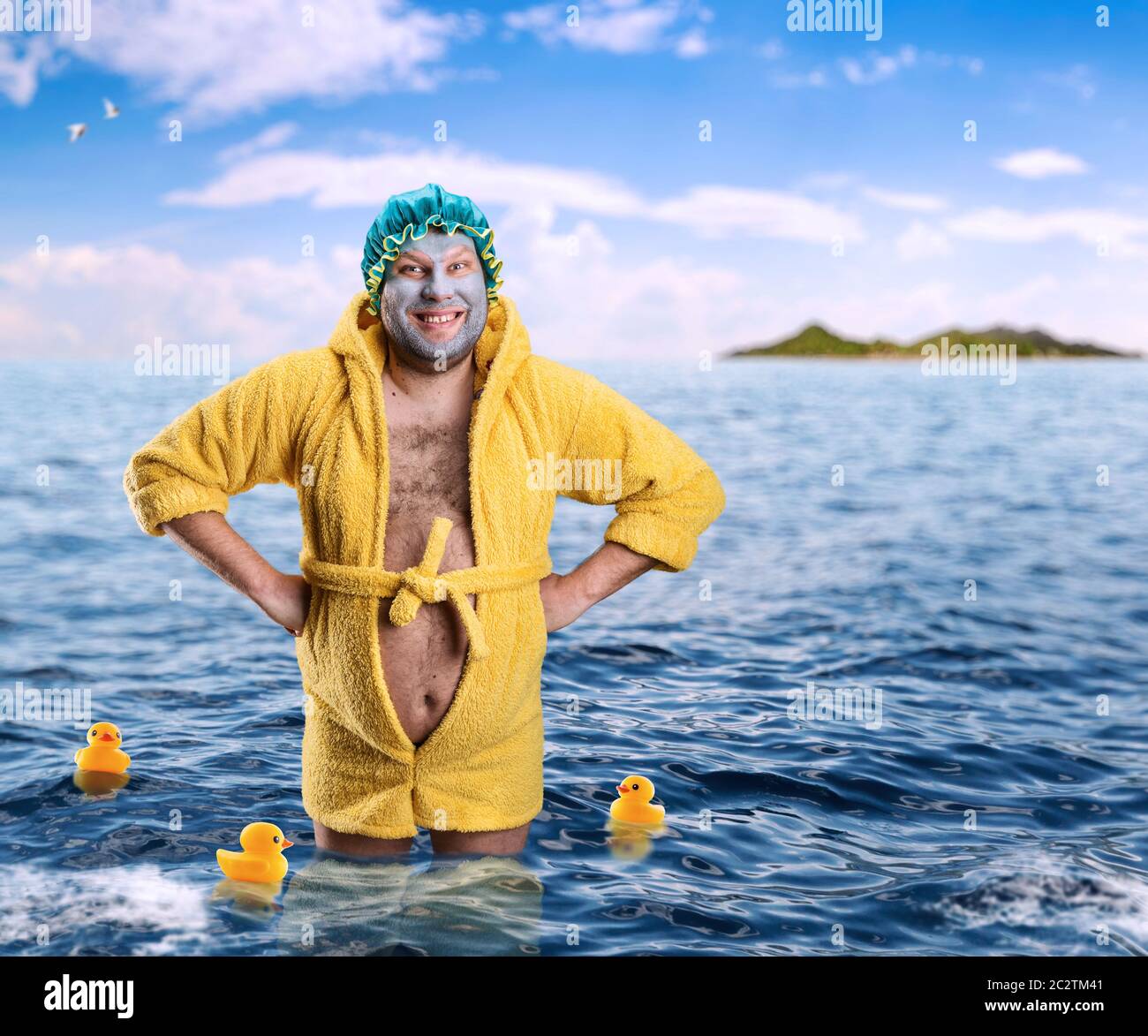 Crazy man with face pack stands in water Stock Photo