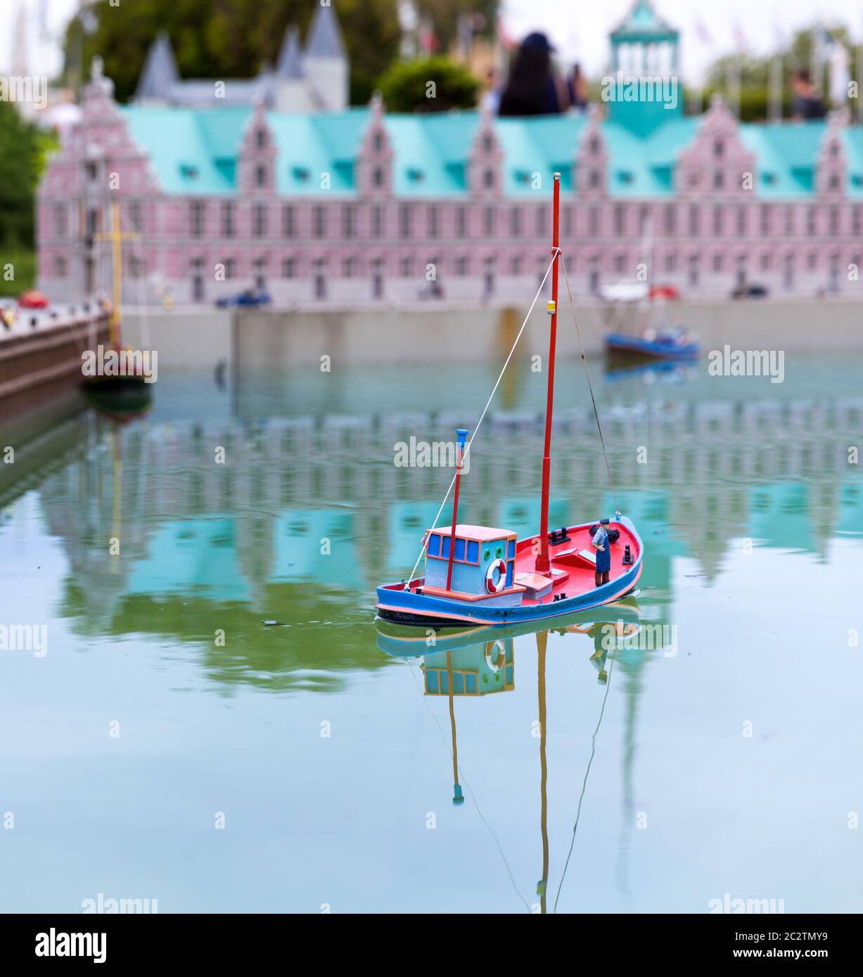 Fishman on fishing boat, miniature scene outdoor, europe. Mini