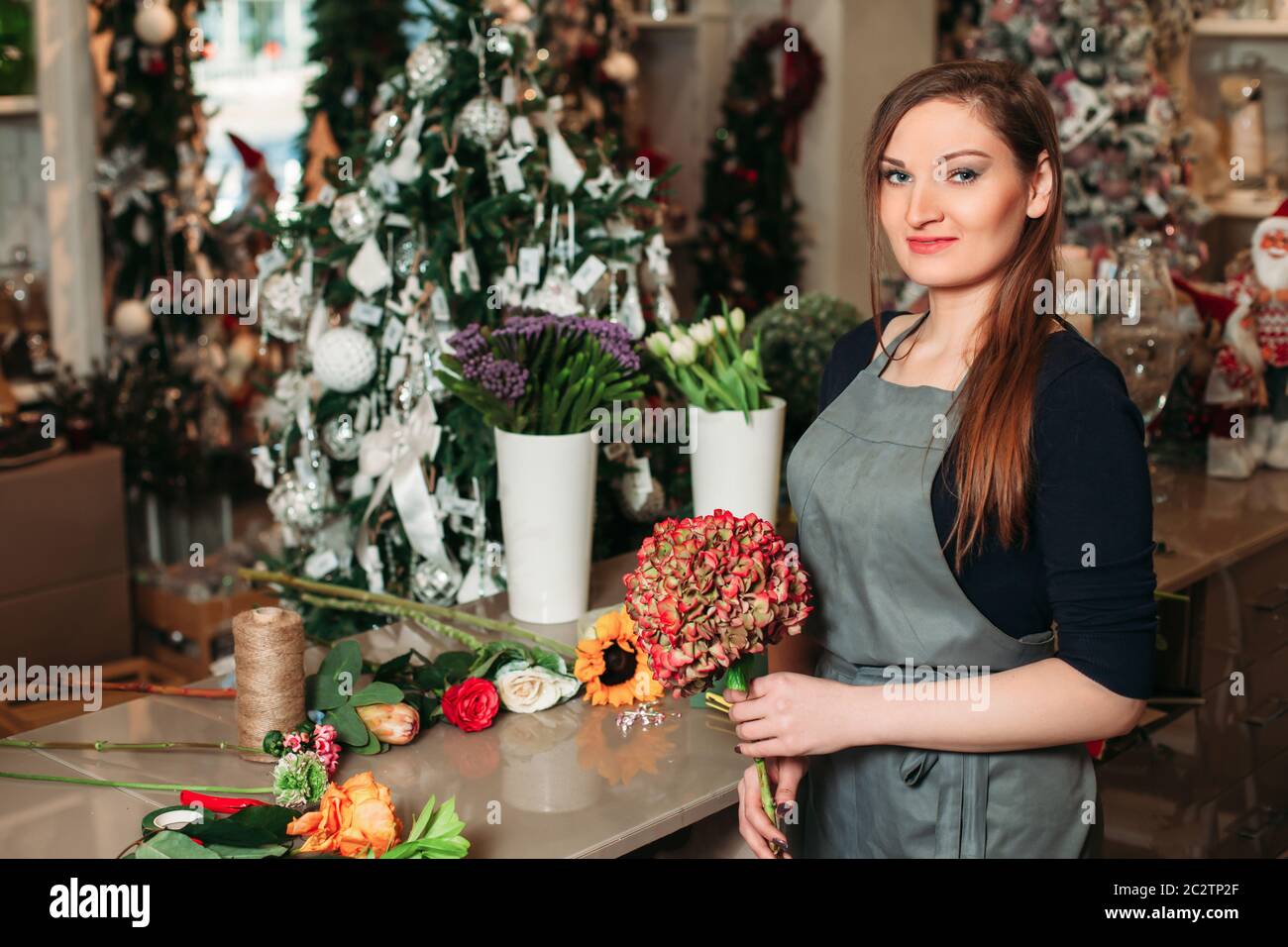 Woman holding beautiful bouquet of flowers. Florist with her work Stock ...