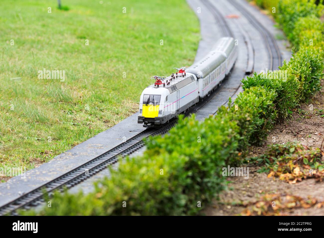 The train goes by railway, miniature scene outdoor, europe. Mini