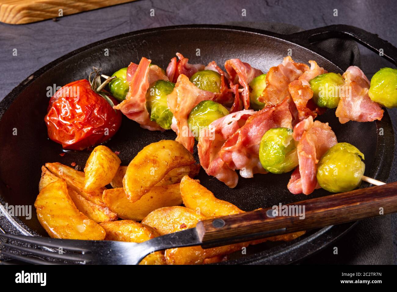 Brussels sprouts Bacon skewers with potato widgets Stock Photo Alamy