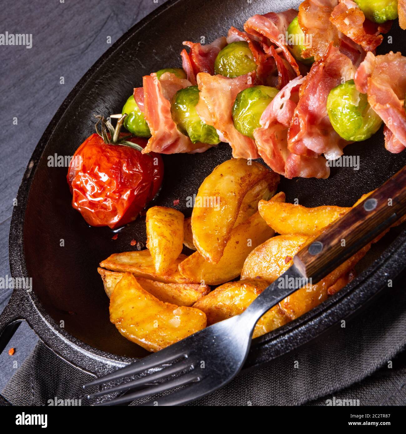 Brussels sprouts Bacon skewers with potato widgets Stock Photo Alamy