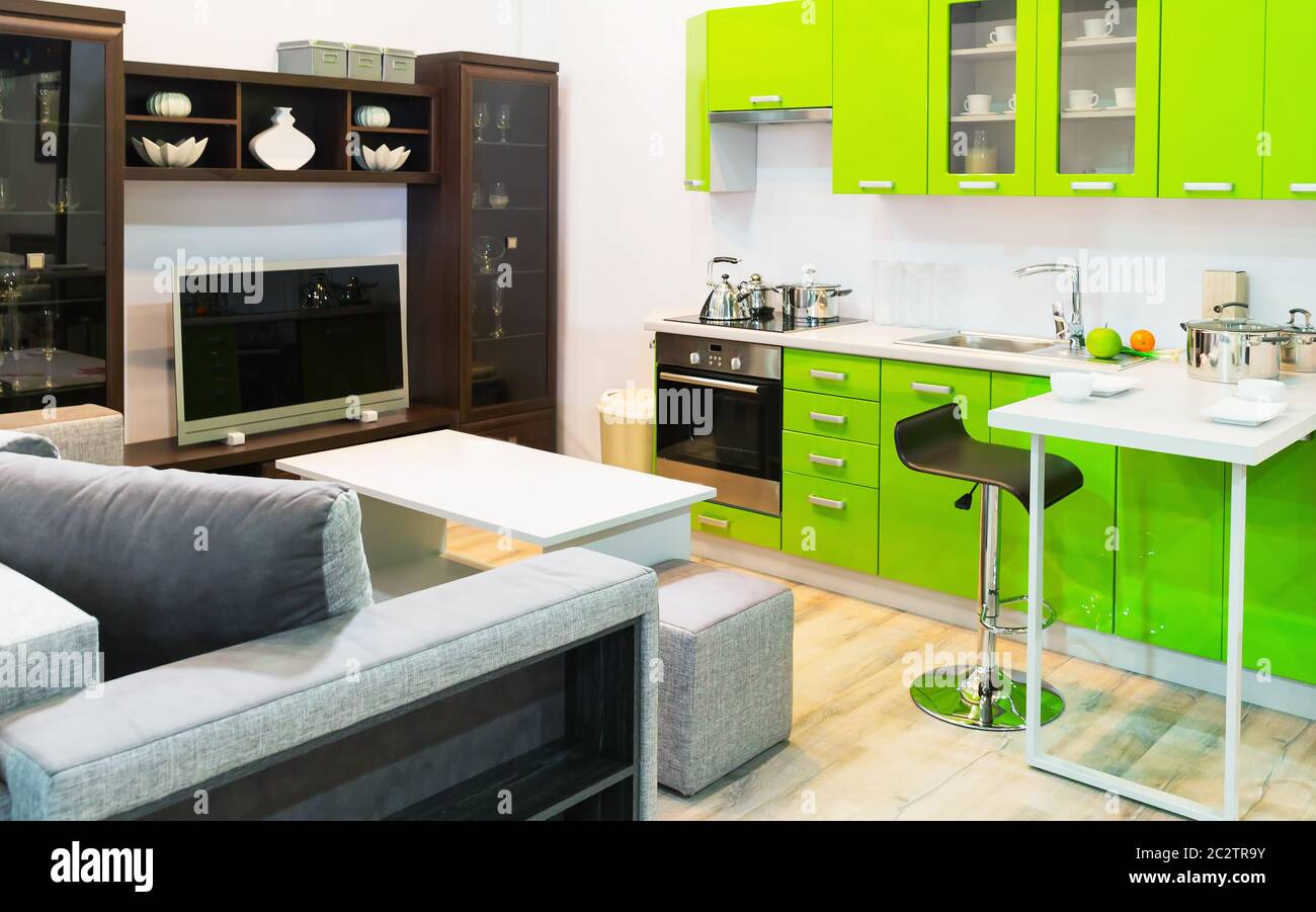 Modern light green kitchen and room clean interior design Stock Photo