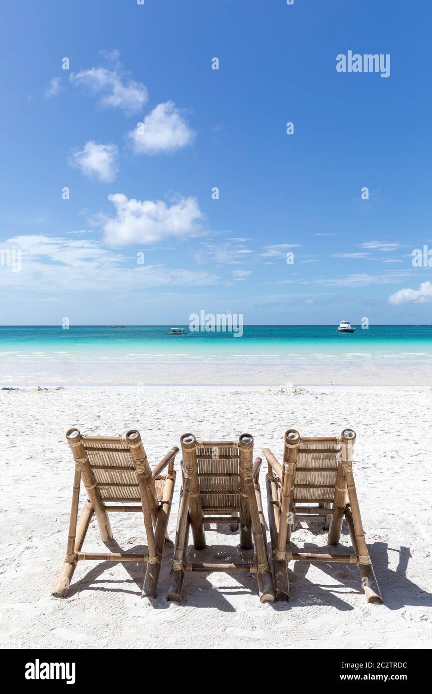 bamboo seating chairs on white beach, borocay island, Philippines Stock