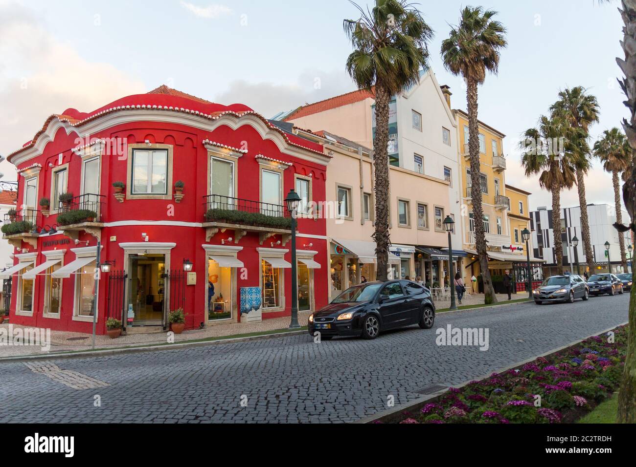 Loja das Meias store, Cascais, Portugal. Beautiful red building that hosts  a luxury fashion store. Typical portuguese architecture. Fashion icon Stock  Photo - Alamy