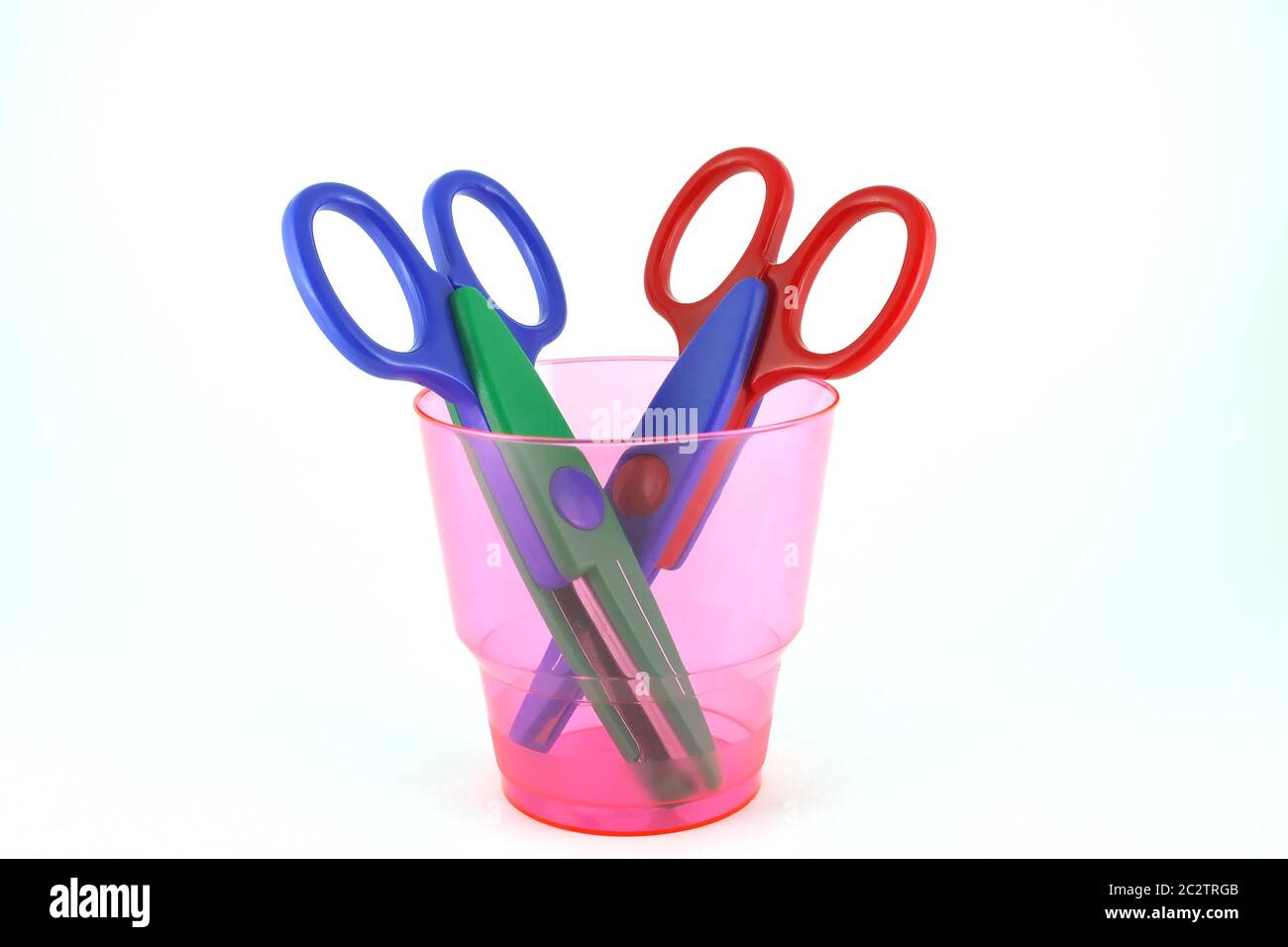 Two color scissors for paperworks in the pink stay Stock Photo - Alamy