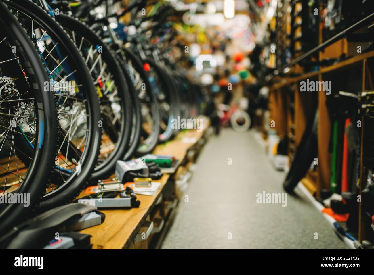 Bicycle shop, rows of new bikes. Equipment and accessories for cycles