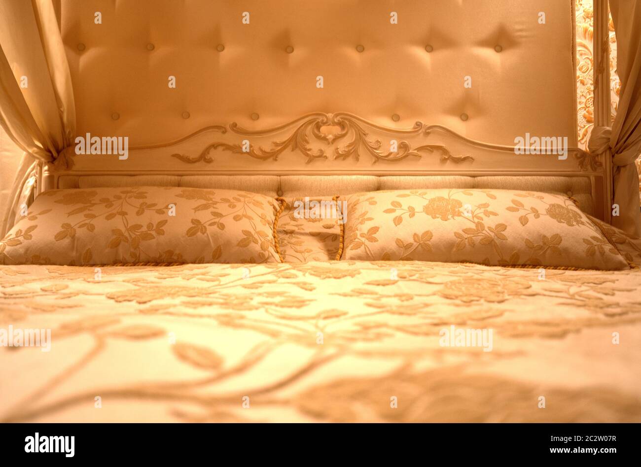 Interior of luxury vintage bedroom. Toned in gold Stock Photo - Alamy