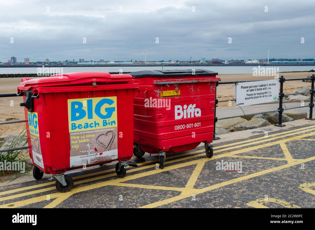 New Brighton, UK: Jun 3, 2020: A pair of commercial trash bins are available for public use on the promenade. Stock Photo