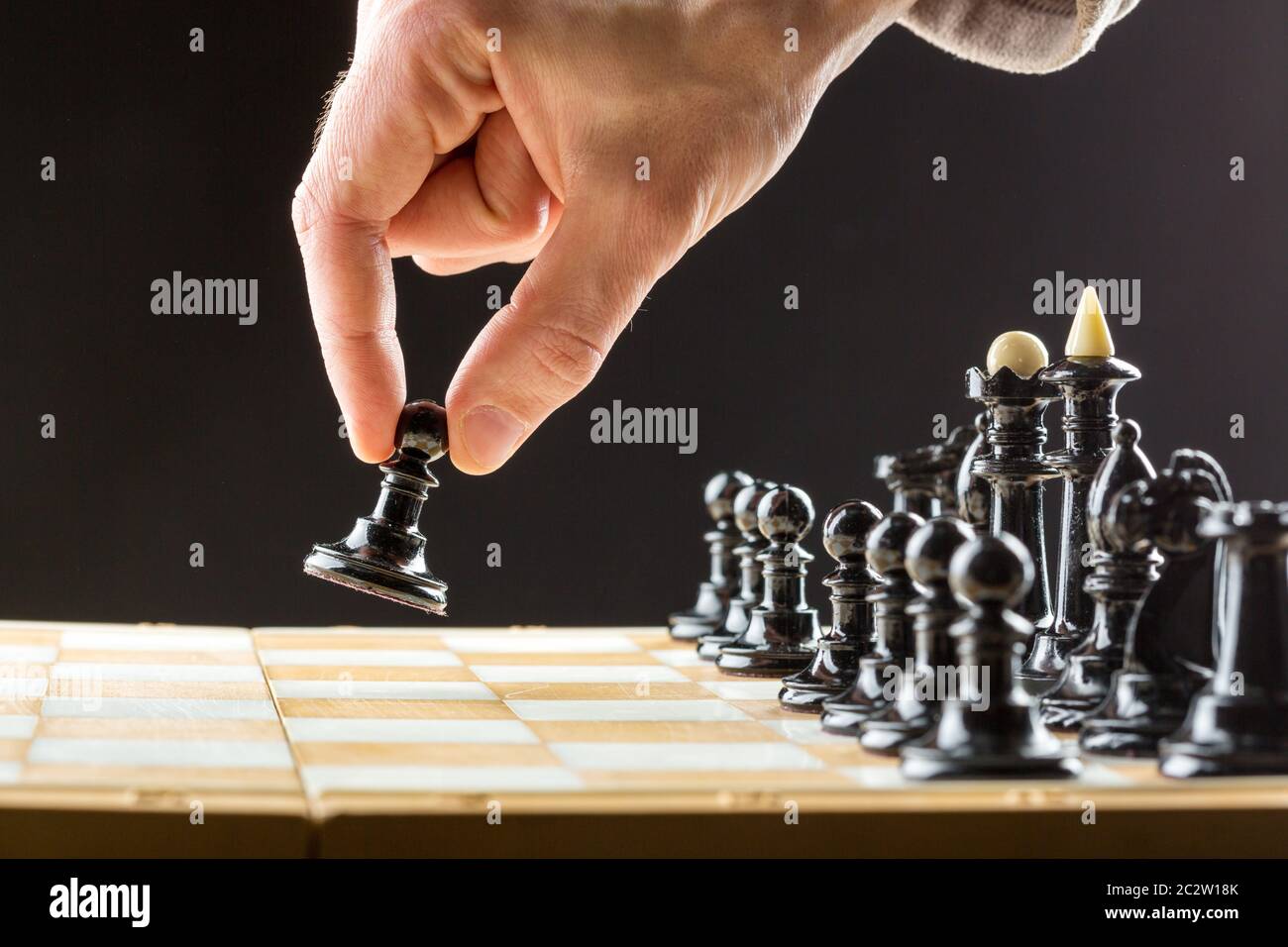 Close up of man's hand playing chess Stock Photo - Alamy