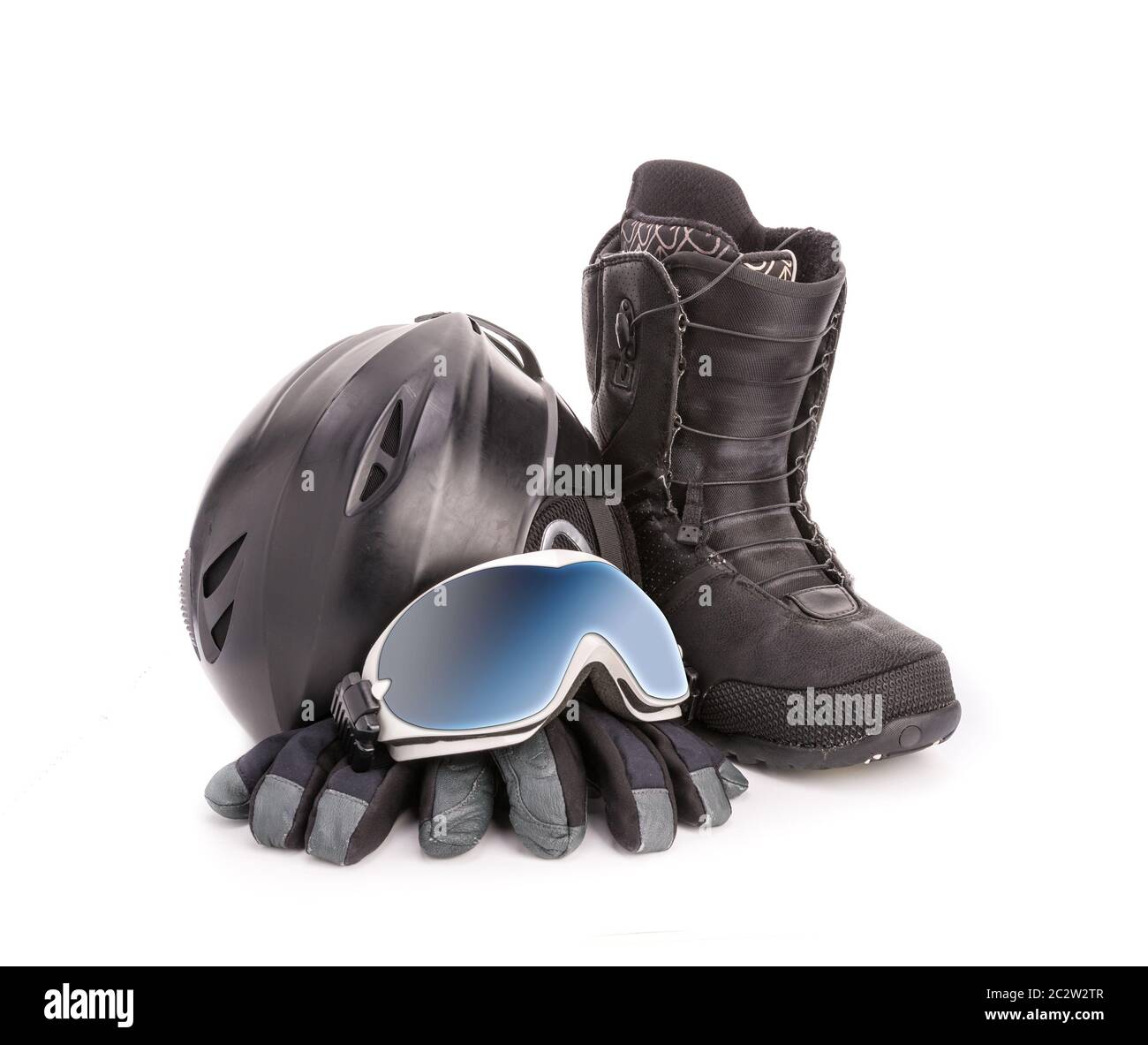 Winter sport glasses, snowboarding boot, helmet and gloves on white