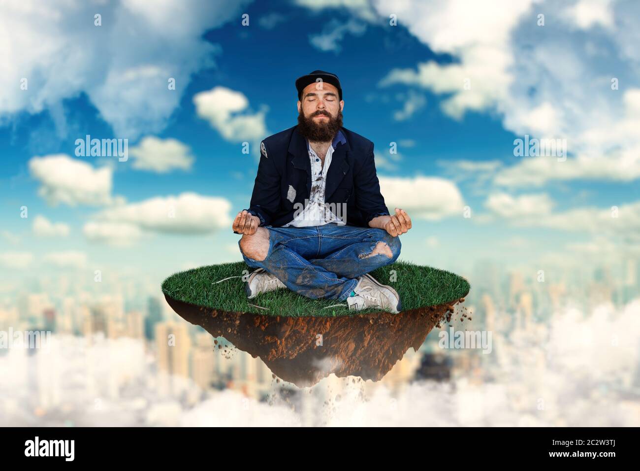 Homeless is meditating on flying island in the sky Stock Photo