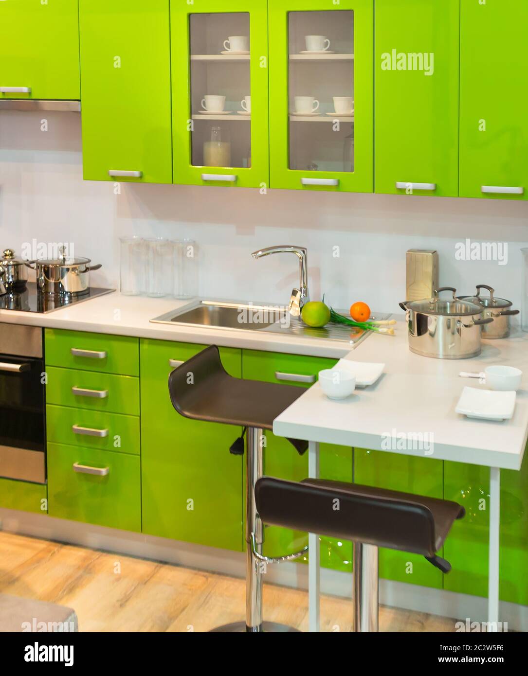 Modern light green kitchen clean interior design Stock Photo - Alamy