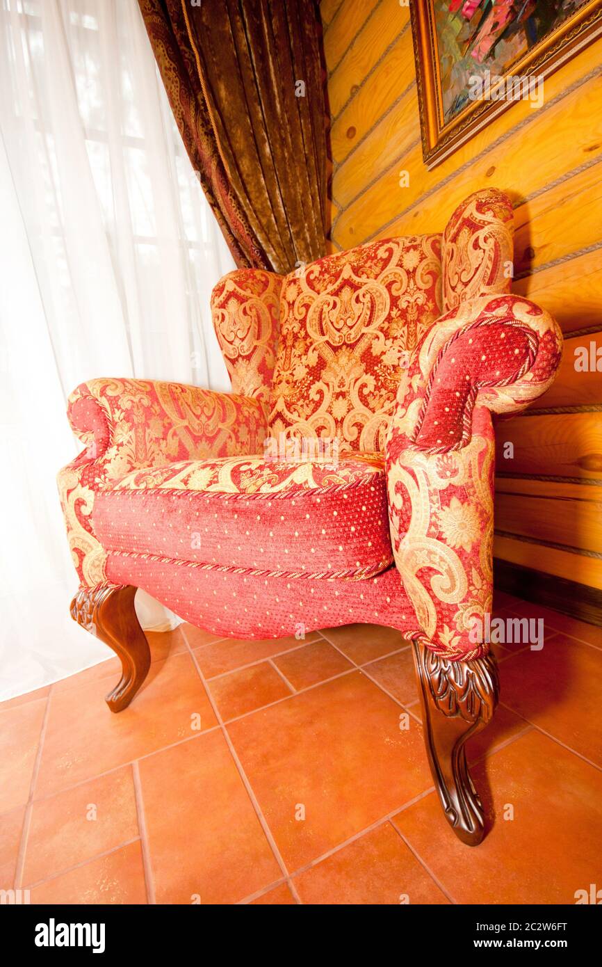Red retro chair near the window Stock Photo Alamy