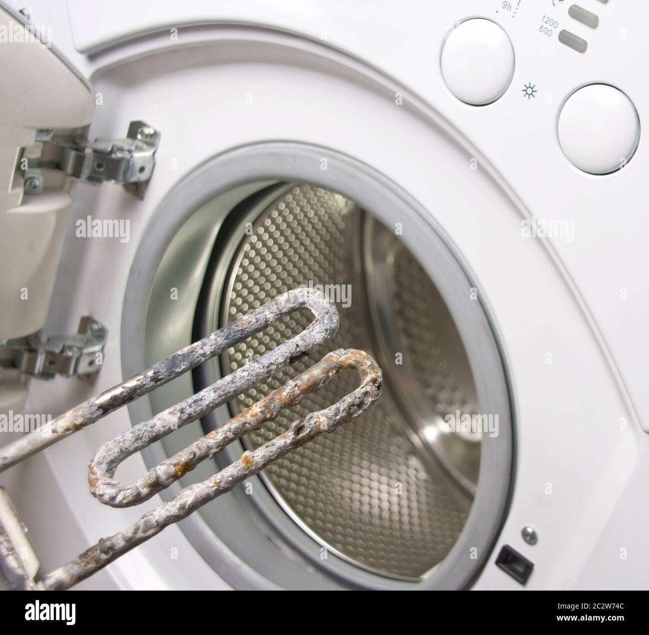 Washing machine and damaged electric heater Stock Photo Alamy