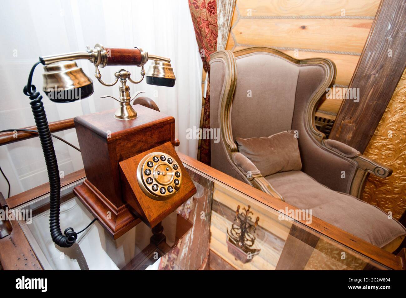 Vintage interior - telephone and armchair Stock Photo - Alamy
