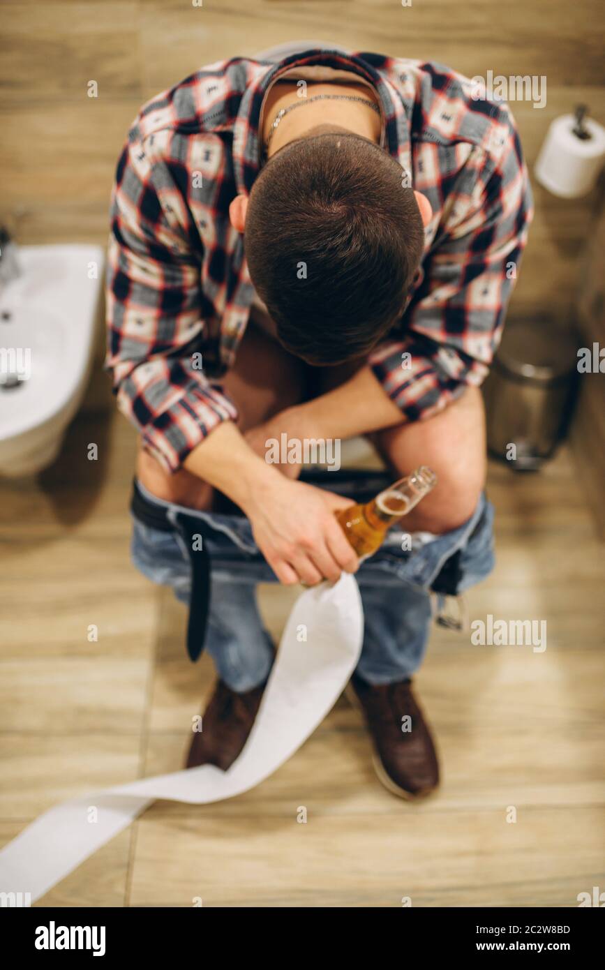 masterpiece Adaptability collision Man with bottle of beer sitting on toilet with his pants down, top view, after house party. Drunk male person with headache Stock Photo - Alamy masterpiece Adaptability collision Man with bottle of beer sitting on toilet with his pants down, top view, after house party. Drunk male person with headache Stock Photo - Alamy