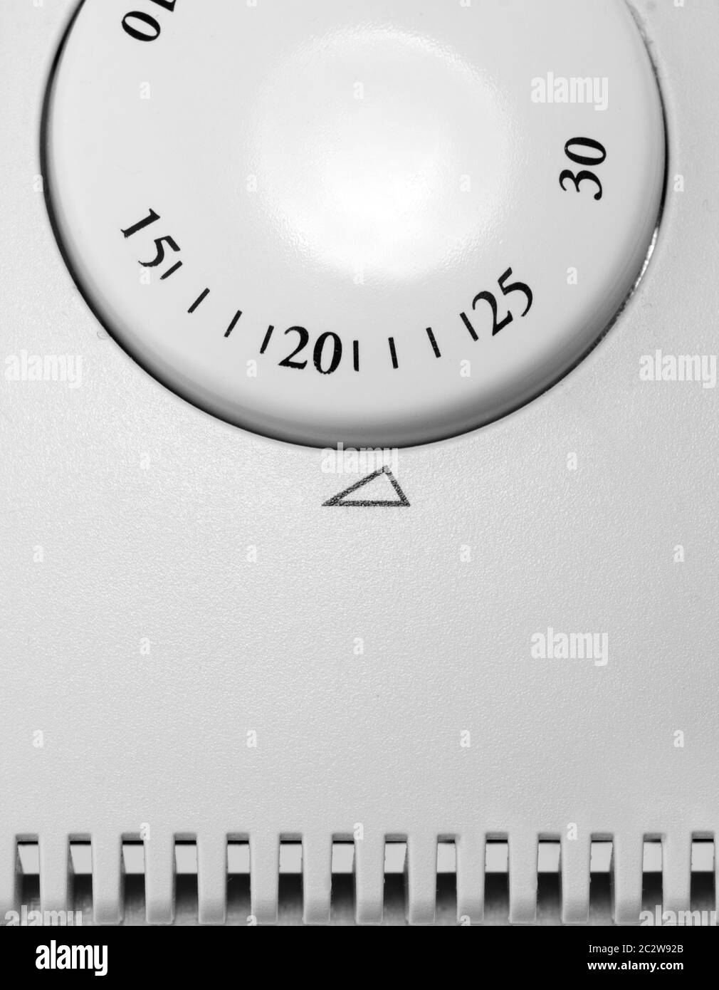 Close-up of room thermostat dial. In B/W Stock Photo
