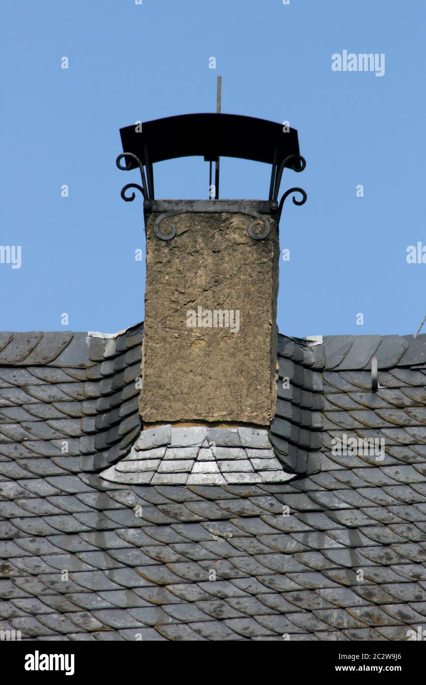 Chimney hood on slate roof Stock Photo Alamy