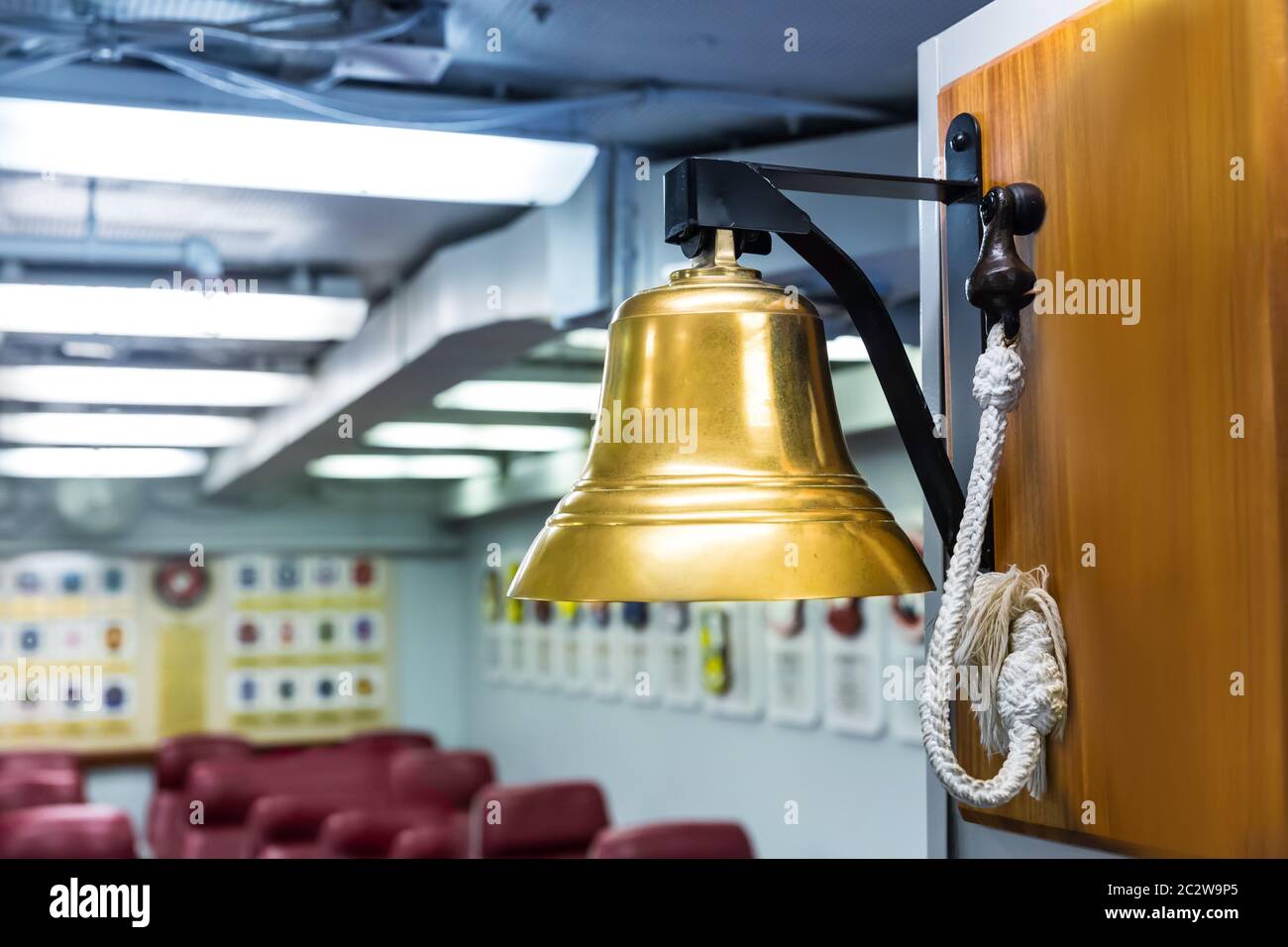 Navy ship bell. Golden marine bell in museum . Stock Photo