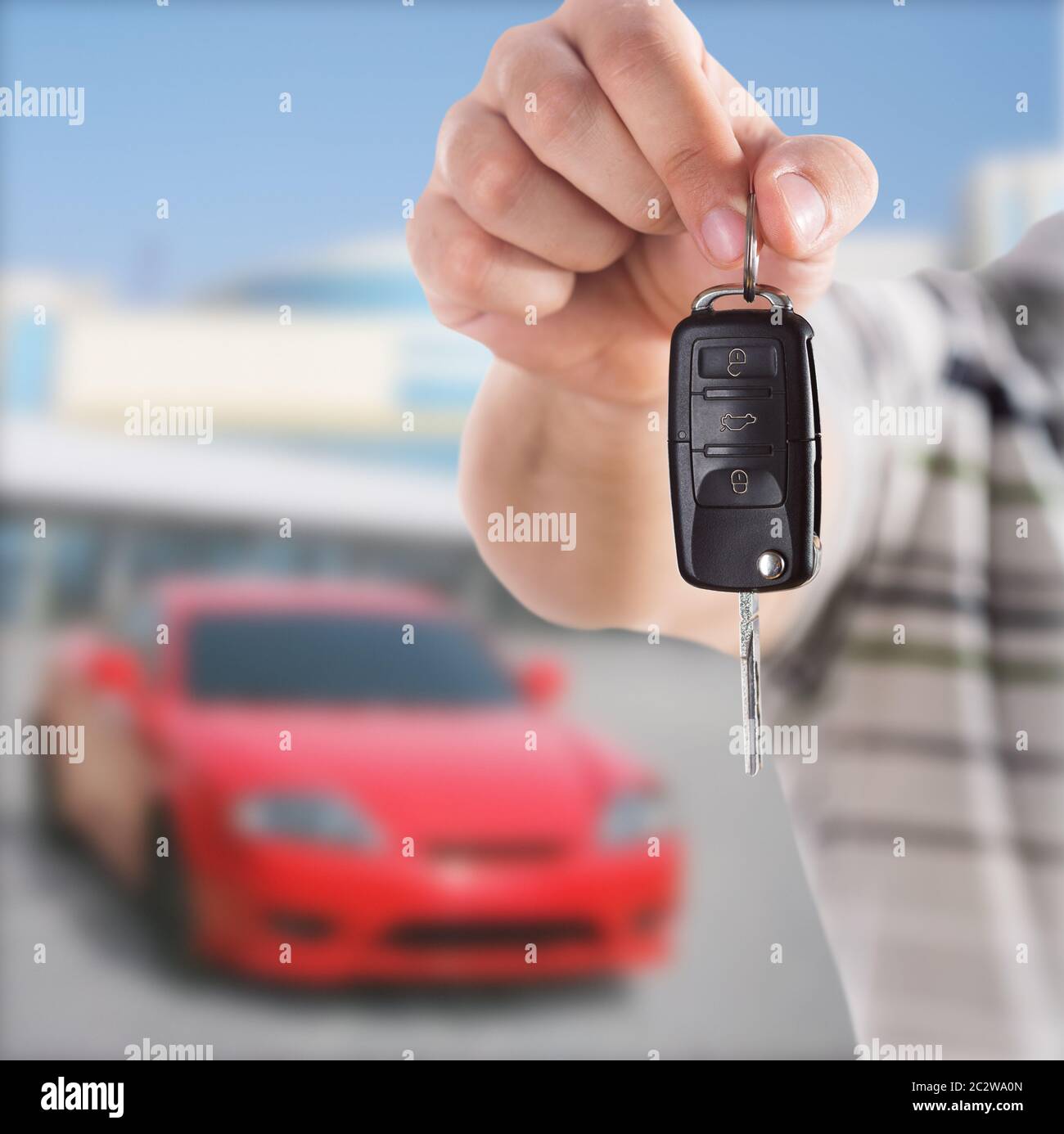 Male hand giving you car key Stock Photo - Alamy