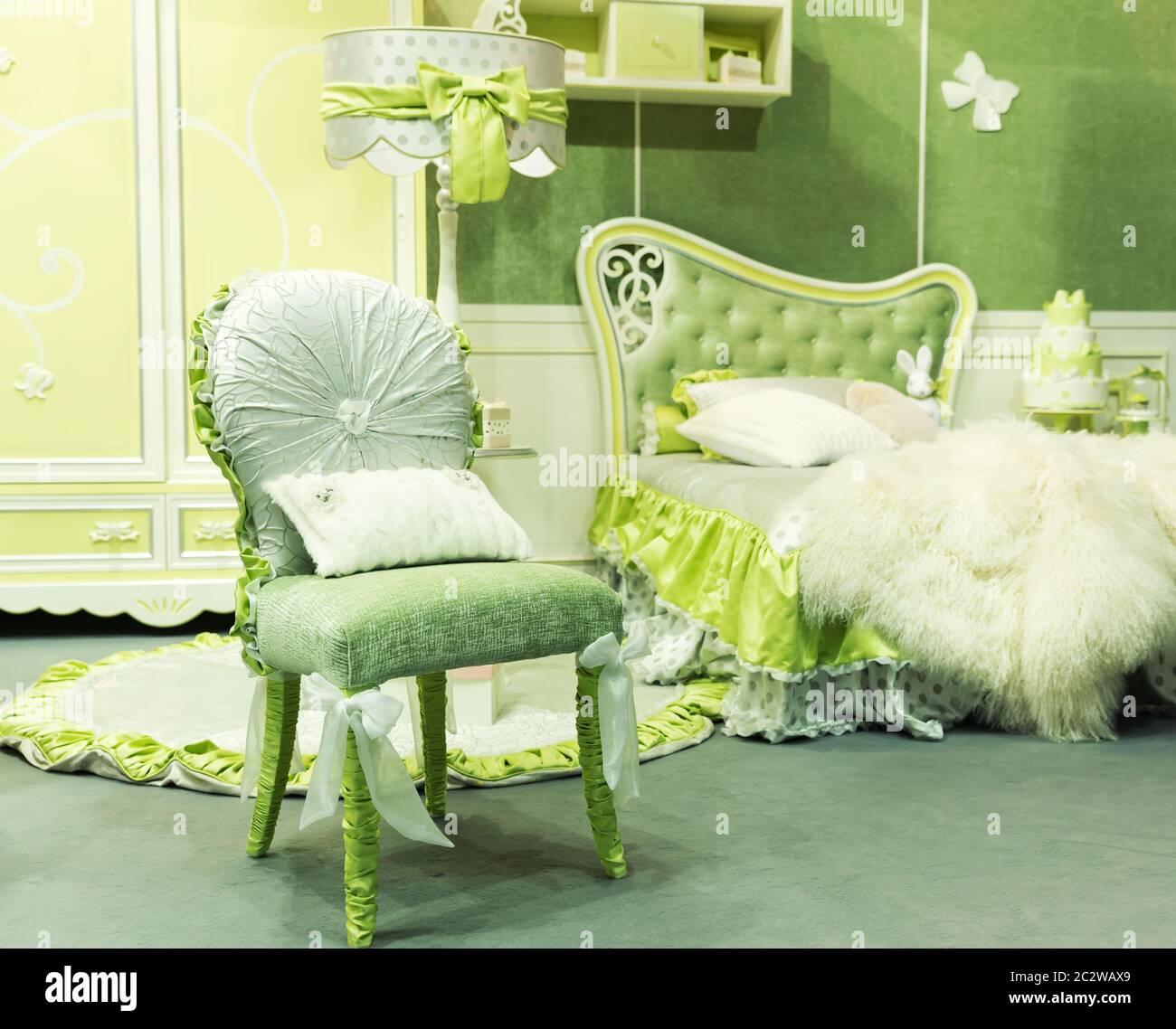 Nice luxury light green bedroom with chair Stock Photo - Alamy