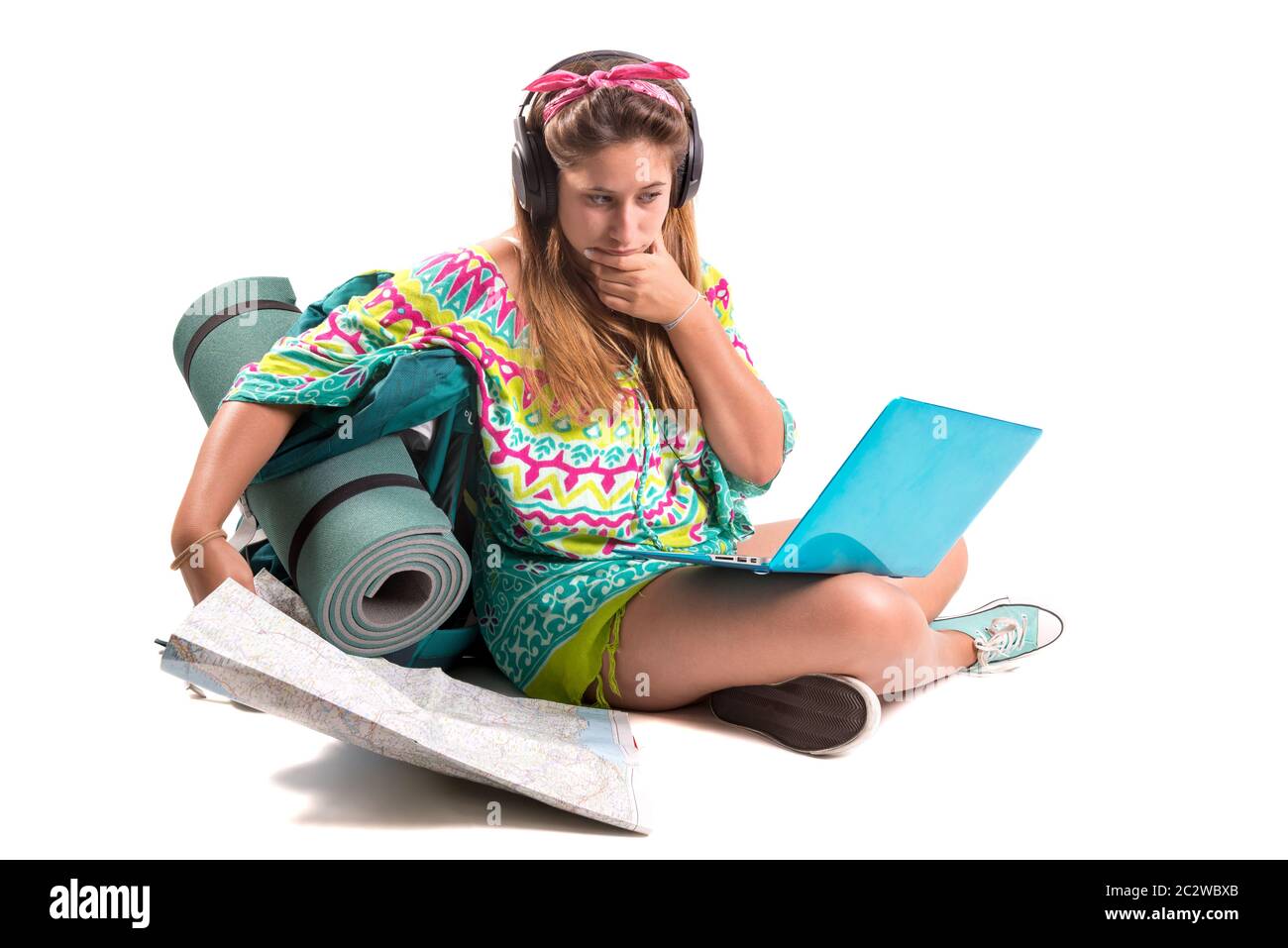 Hiker girl with laptop isolated in white, trekking and travel lifestyle concept Stock Photo