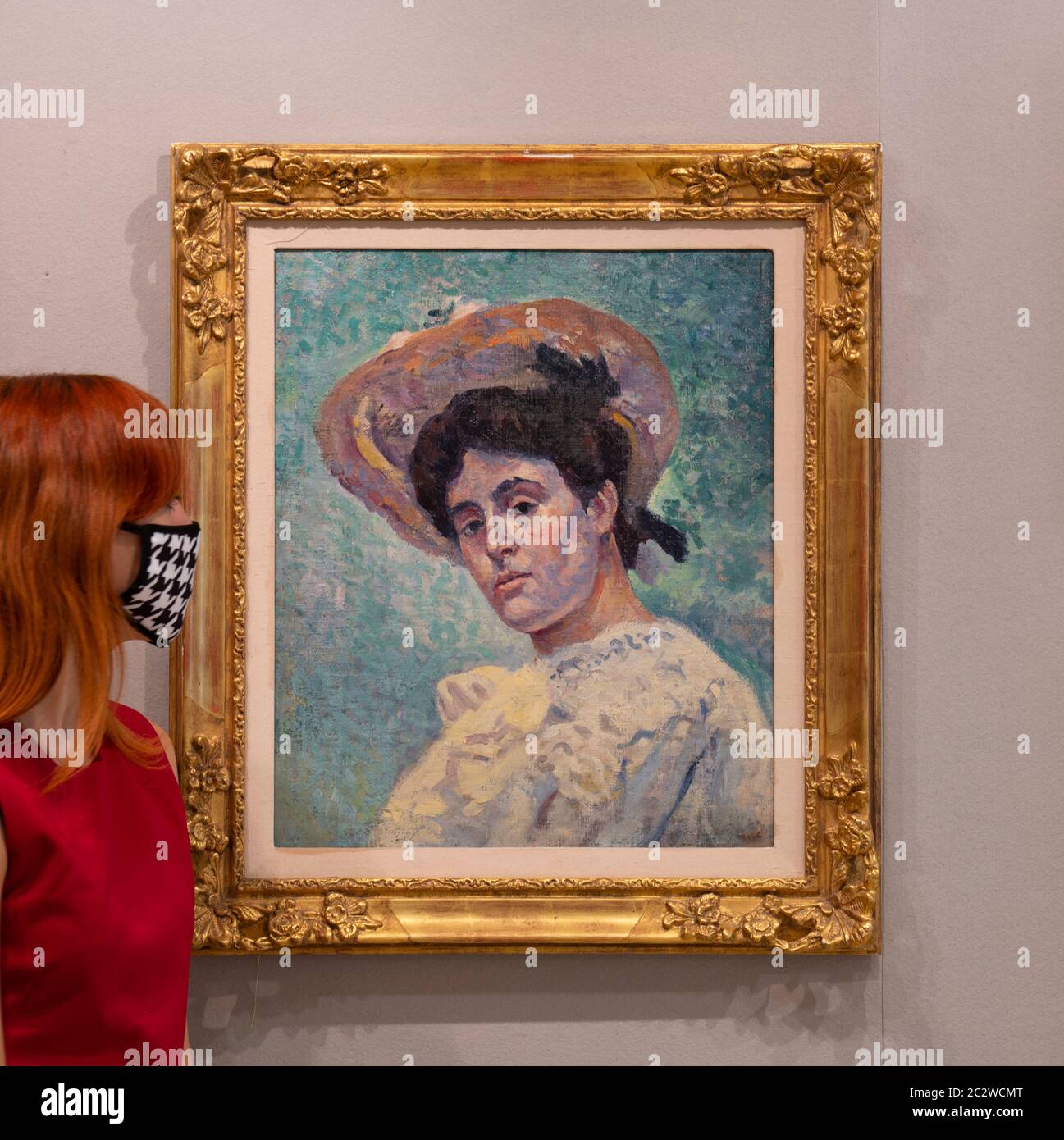 Bonhams, New Bond Street, London, UK. 18th June 2020. Bonhams Modern and Contemporary Art sale preview,  with viewings by timed appointment. The sale will be held on 23 June. Image: Bonhams staff view Maximilien Luce (1858-1941). Portrait of Philiberte Givort, 1906. Estimate £7,000-10,000. Credit: Malcolm Park/Alamy Live News. Stock Photo