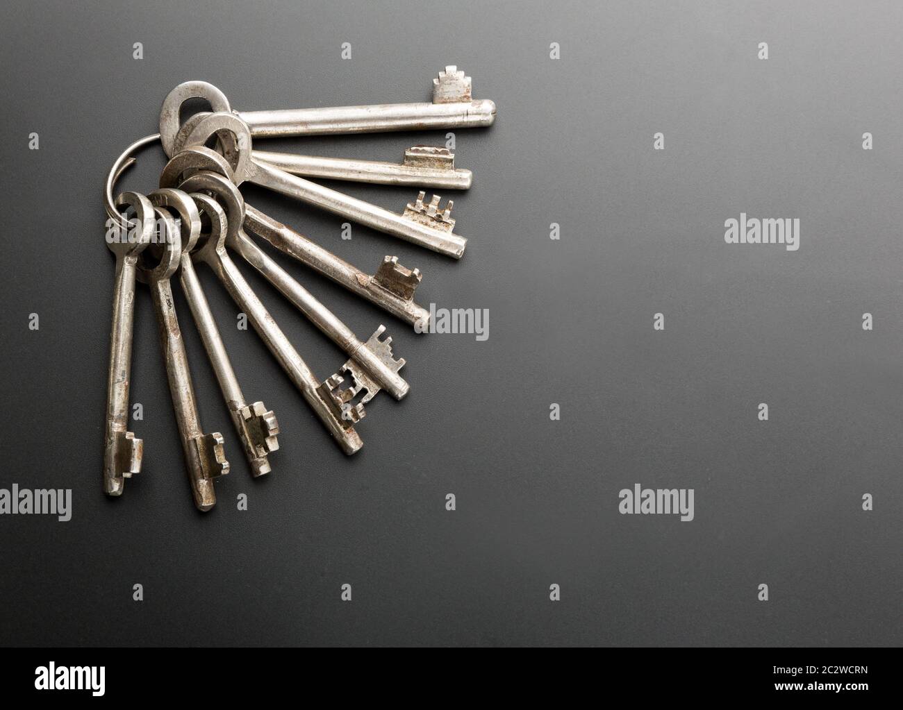 Bunch of keys on grey background Stock Photo