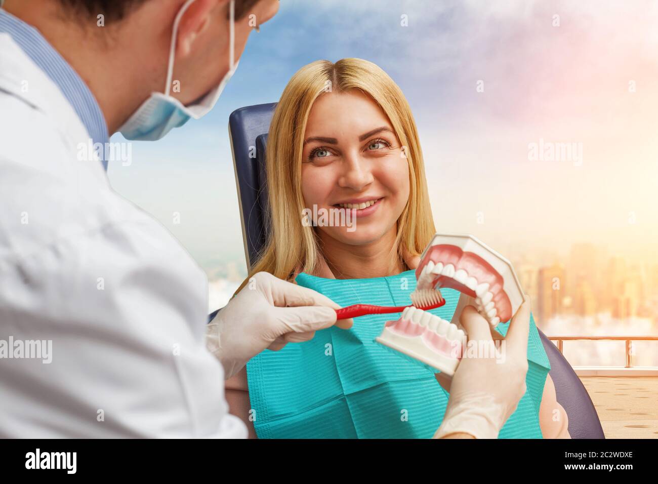 Dentist is showing how to wash the teeth Stock Photo Alamy