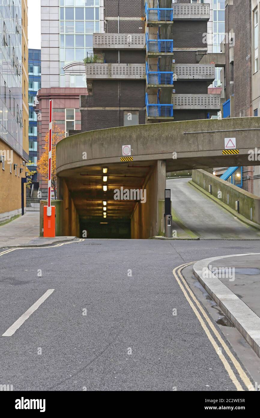 Entrance Ramp to Underground Parking Garage in City Stock Photo