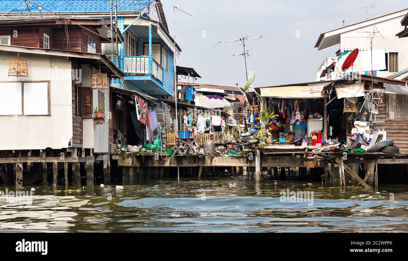 Shanty-town. Slum on dirty canal in Thailand Stock Photo - Alamy