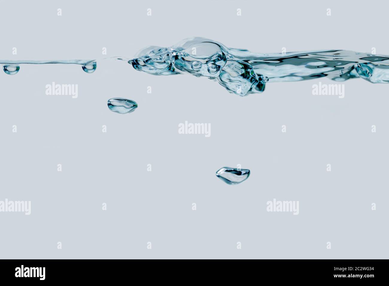 Row of air bubbles and two small bubbles Stock Photo
