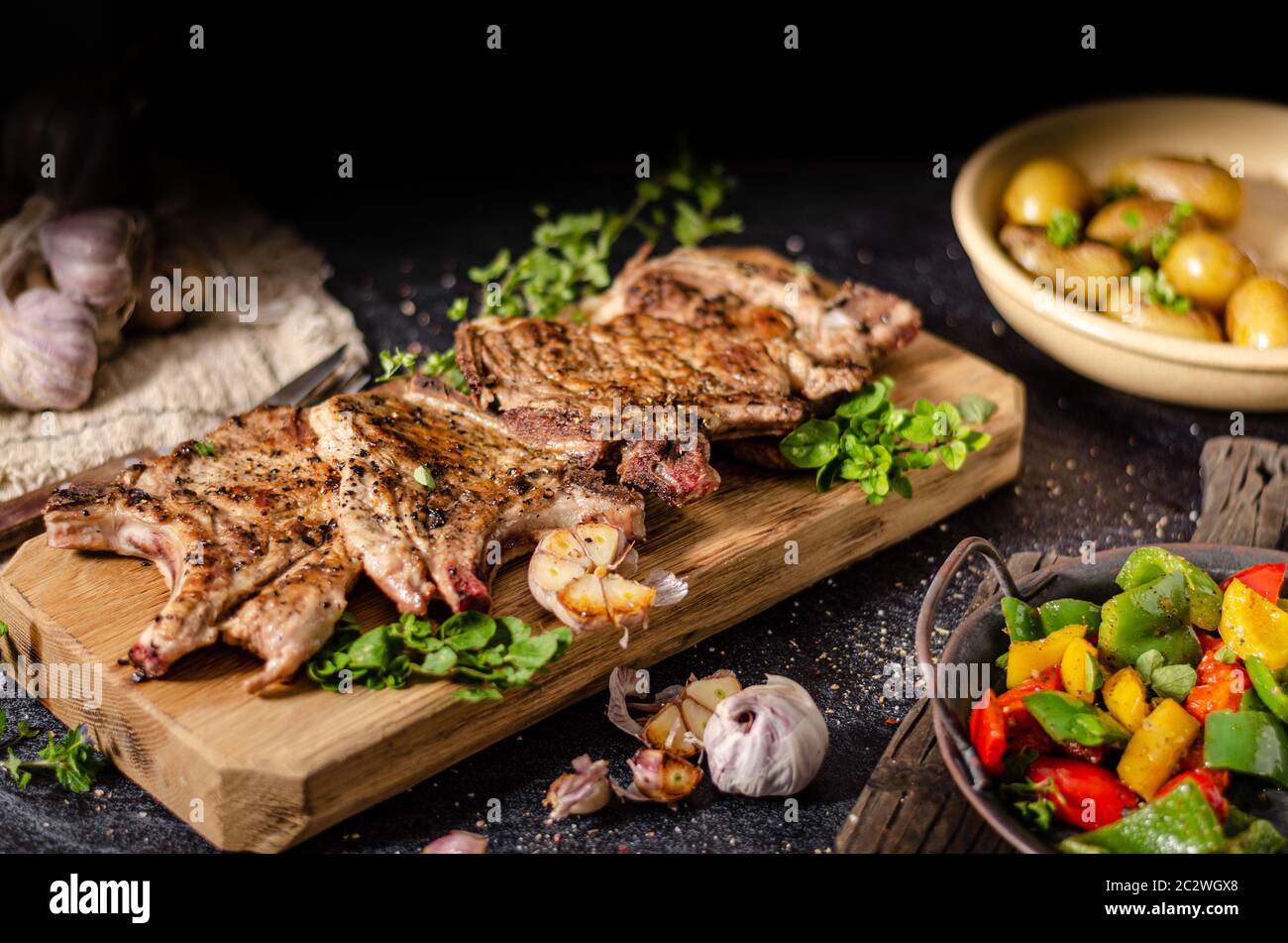 Delicious grilled meat seasoned with garlic and pepper, fresh salad