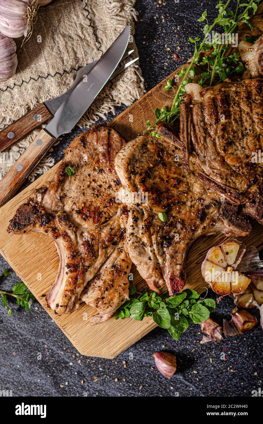 Delicious grilled meat seasoned with garlic and pepper, fresh salad