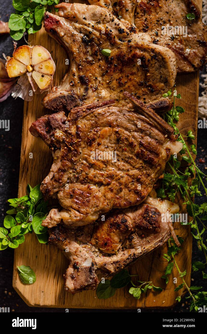 Delicious grilled meat seasoned with garlic and pepper, fresh salad