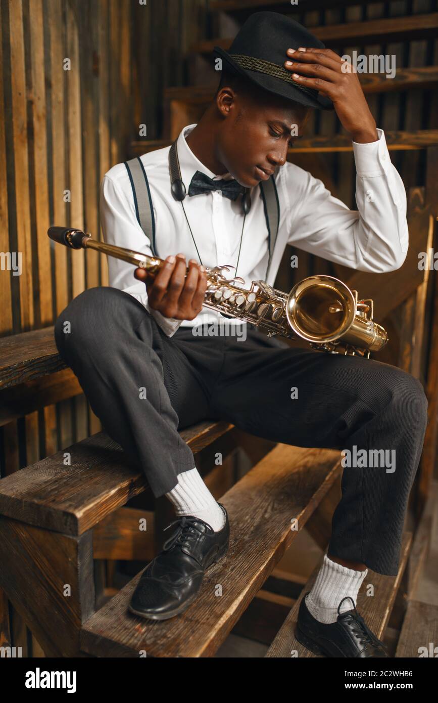 Black jazz musician sitting with 